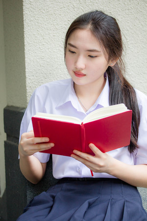 asia thai high school student uniform beautiful girl read a bookの写真素材