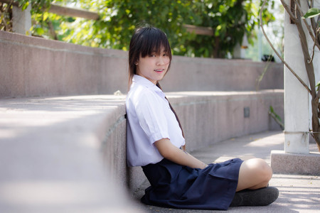 Portrait of thai high school student uniform teen beautiful girl happy and relaxの写真素材
