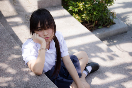 Portrait of thai high school student uniform teen beautiful girl happy and relaxの写真素材