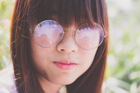 Portrait of thai high school student uniform teen glasses beautiful girl happy and relaxの写真素材