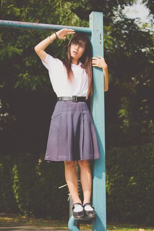 Portrait of thai high school student uniform teen glasses beautiful girl happy and relaxの写真素材