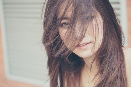 Portrait of thai china adult beautiful girl relax and smileの写真素材