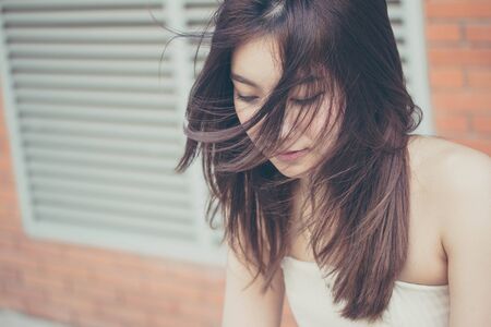 Portrait of thai china adult beautiful girl relax and smileの写真素材