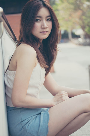 Portrait of thai china adult beautiful girl relax and smileの写真素材