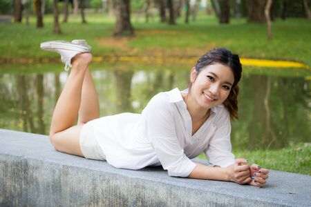 Portrait of thai adult working women white shirt relax and smileの写真素材