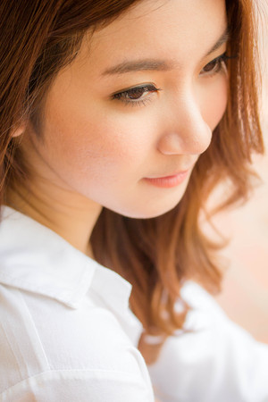 Portrait of thai adult working women white shirt relax and smileの写真素材