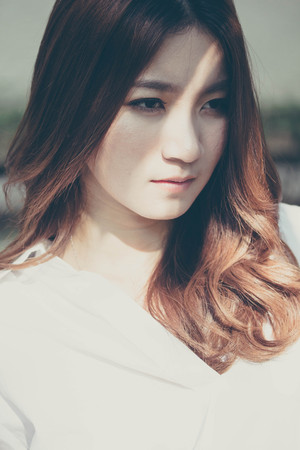 Portrait of thai adult working women white shirt relax and smileの写真素材