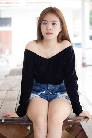Portrait of thai adult beautiful girl relax and smileの写真素材