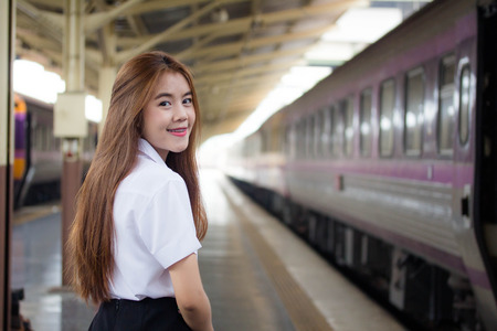 Portrait of thai adult student university uniform beautiful girl relax and smile