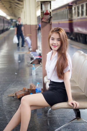 Portrait of thai adult student university uniform beautiful girl relax and smileの写真素材
