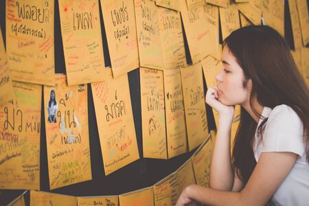 Portrait of thai adult student university uniform beautiful girl relax and smileの写真素材