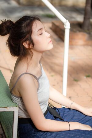 Portrait of thai adult beautiful girl relax and smileの写真素材