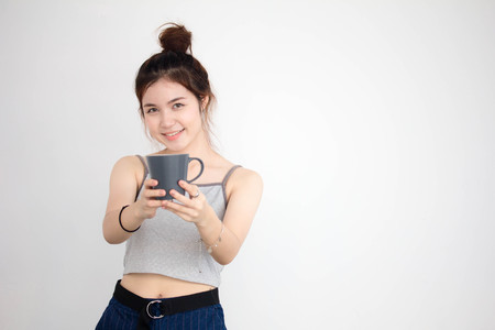 Portrait of thai adult beautiful girl drinking coffeeの写真素材