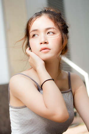 Portrait of thai adult beautiful girl relax and smileの写真素材