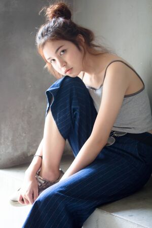 Portrait of thai adult beautiful girl relax and smileの写真素材