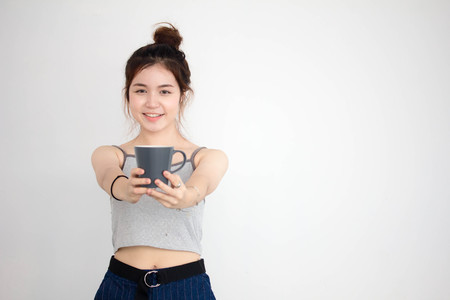 Portrait of thai adult beautiful girl drinking coffeeの写真素材
