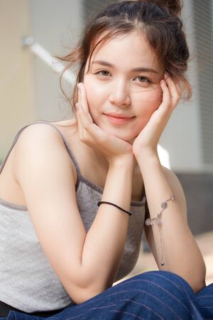 Portrait of thai adult beautiful girl relax and smileの写真素材