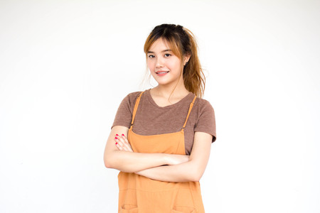 Beautiful young adult thai chinese bronze hair relax and smileの写真素材