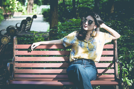 Portrait of thai yellow shirt adult beautiful girl relax time, in Vintage Styleの写真素材