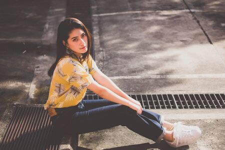 Portrait of thai yellow shirt adult beautiful girl relax time, in Vintage Styleの写真素材