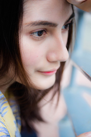 Portrait of thai yellow shirt adult beautiful girl relax and smileの写真素材