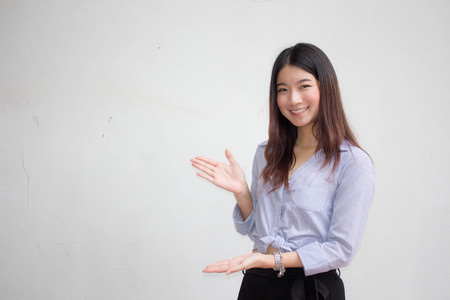 Portrait of thai adult beautiful girl pointingの写真素材