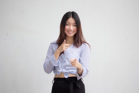 Portrait of thai adult beautiful girl pointingの写真素材