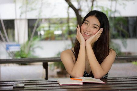 Portrait of thai china adult beautiful girl relax and smileの写真素材