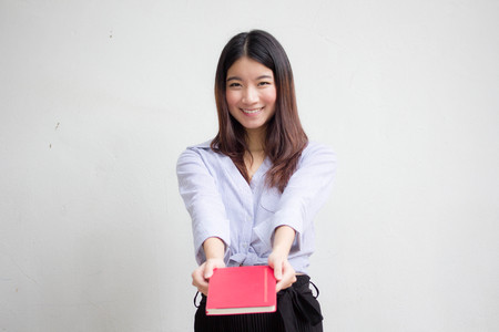 Portrait of thai adult working women show red bookの写真素材