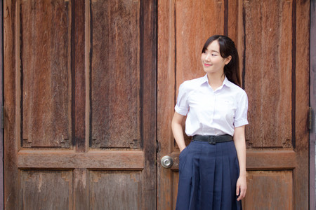 Portrait of thai high school student uniform teen beautiful girl happy and relaxの写真素材
