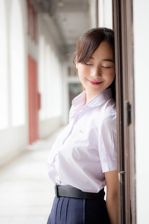 Portrait of thai high school student uniform teen beautiful girl happy and relaxの写真素材