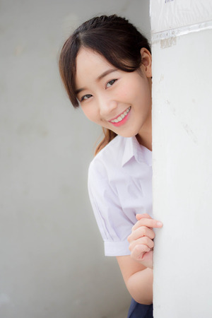 Portrait of thai high school student uniform teen beautiful girl happy and relaxの写真素材