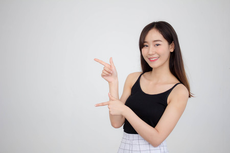 Portrait of thai adult beautiful girl pointingの写真素材