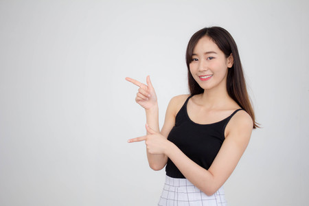 Portrait of thai adult beautiful girl pointingの写真素材