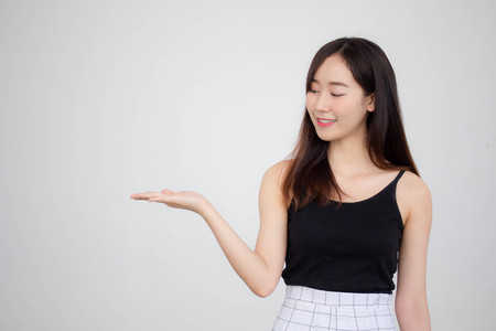 Portrait of thai adult beautiful girl pointingの写真素材