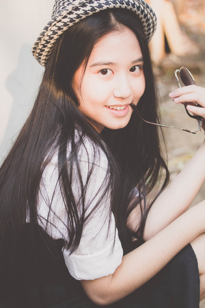 Portrait of thai teen beautiful girl happy and relax.の写真素材