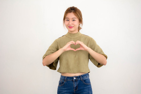 Portrait of thai china adult beautiful girl give heart