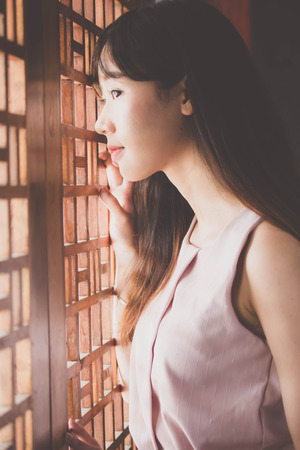 Portrait of thai china adult beautiful girl relax time, in Vintage Styleの写真素材