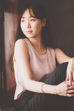 Portrait of thai china adult beautiful girl relax time, in Vintage Styleの写真素材