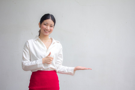 Portrait of thai adult working women white shirt  show handの写真素材