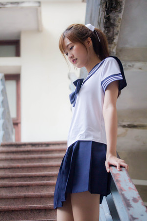 Portrait of thai teen beautiful girl in japanese student uniform happy and relaxの写真素材