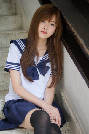 Portrait of thai teen beautiful girl in japanese student uniform happy and relaxの写真素材