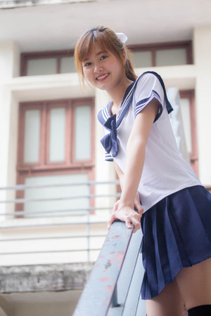 Portrait of thai teen beautiful girl in japanese student uniform happy and relaxの写真素材