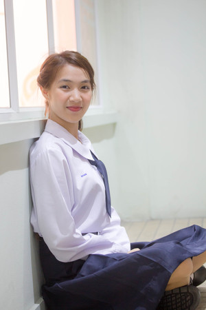 Portrait of thai high school student uniform teen beautiful girl happy and relaxの写真素材