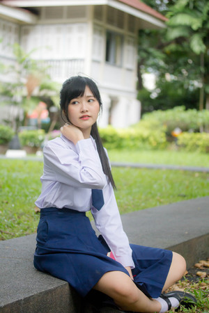 Portrait of thai high school student uniform teen beautiful girl happy and relaxの写真素材