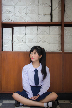 Portrait of thai high school student uniform teen beautiful girl happy and relaxの写真素材