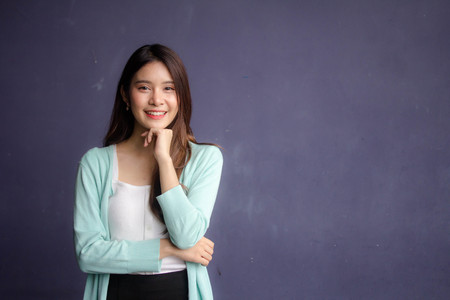 thai china adult office girl white shirt relax and smileの写真素材