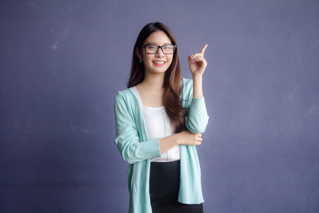 thai china adult office girl glasses pointingの写真素材