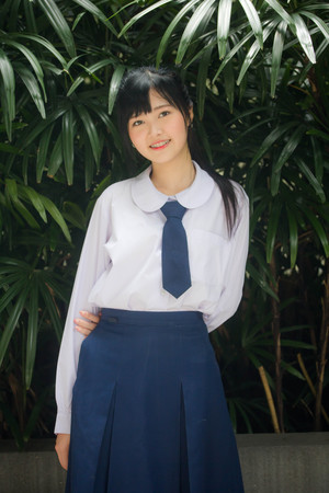 Portrait of thai high school student uniform teen beautiful girl happy and relaxの写真素材