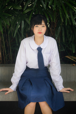 Portrait of thai high school student uniform teen beautiful girl happy and relaxの写真素材